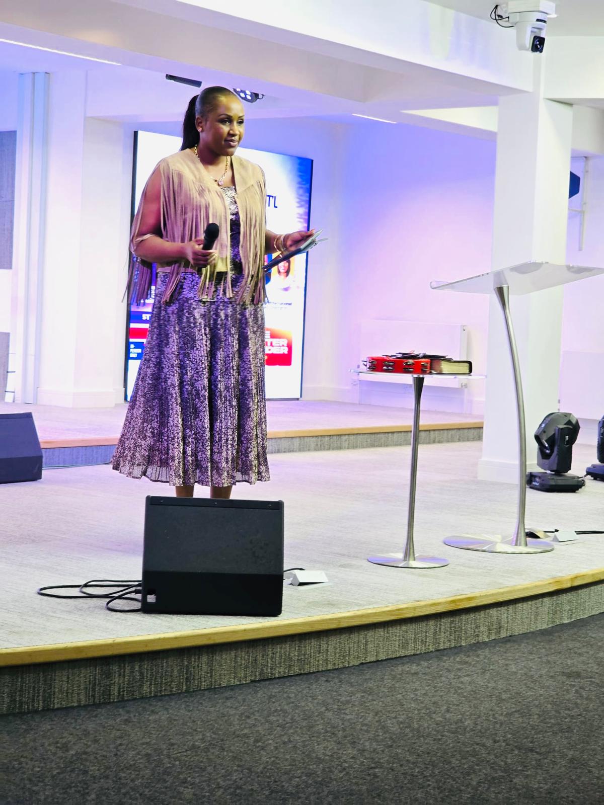 Rev. Eve speaking at conference